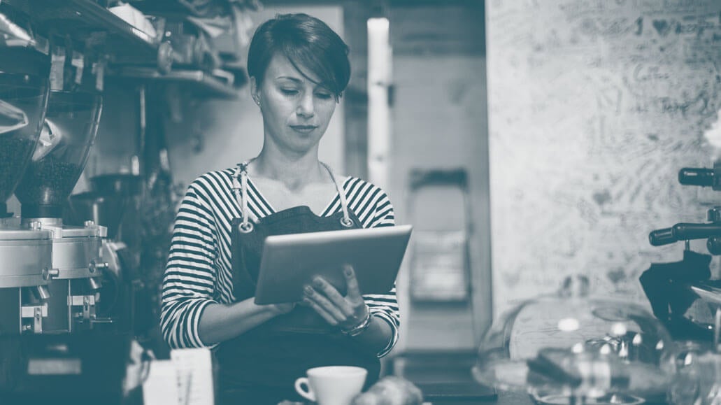 Female chef working on laptop