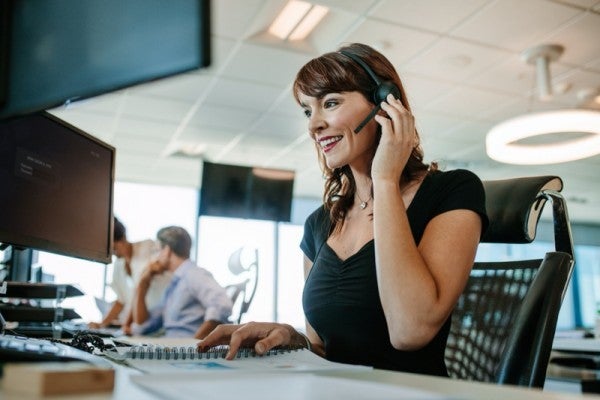Customer service rep wearing a head set.