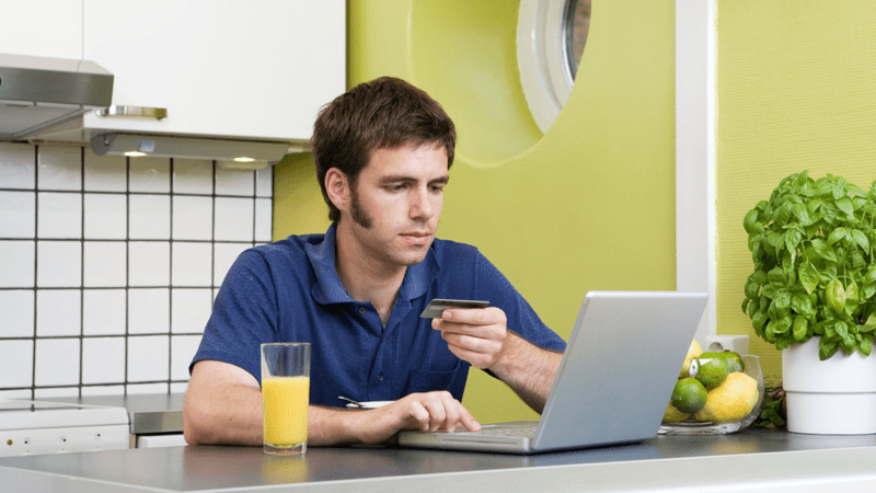 Man making an online purchase with a credit card.