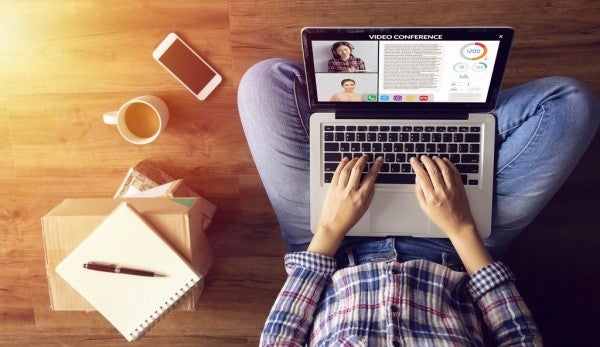 Checking social media account using a laptop computer.