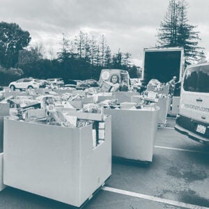 Carts of goodwill items in a parking lot