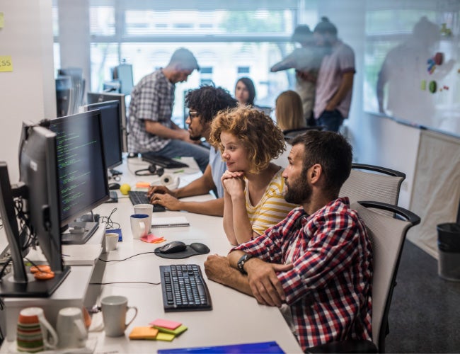 Workers viewing data on computers