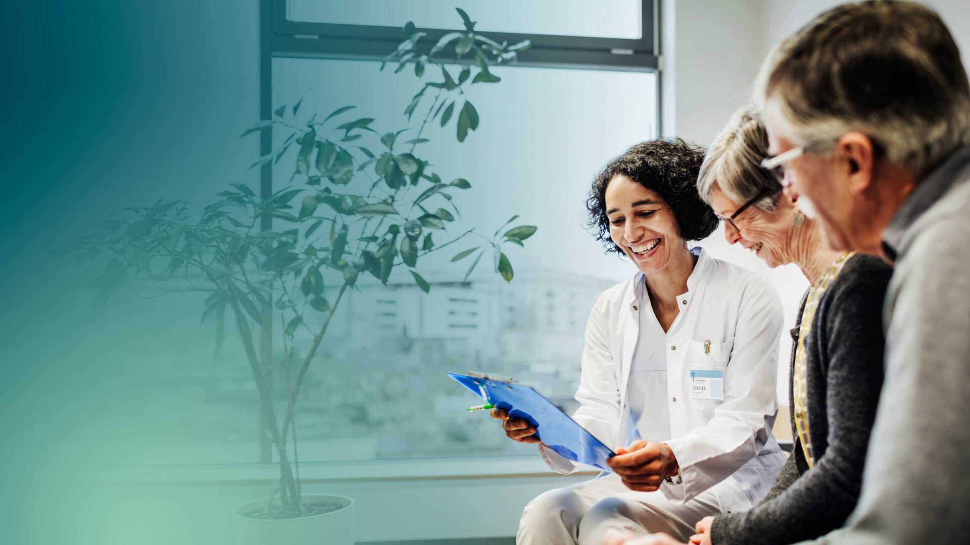 Doctor talking with elderly couple