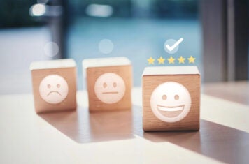 wooden blocks with face emojis