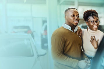 Car buyers in showroom