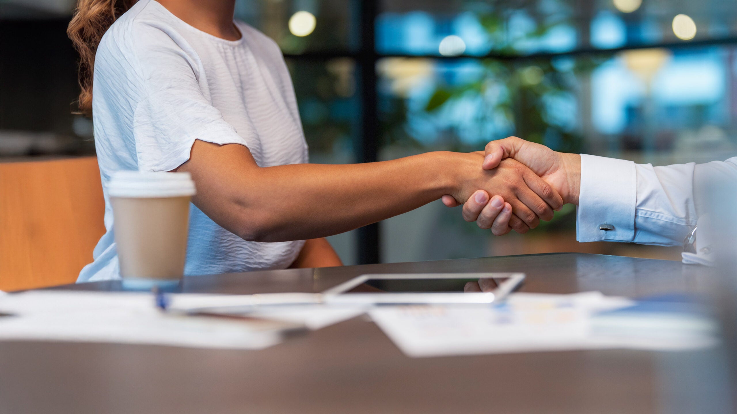 woman and man shaking hands