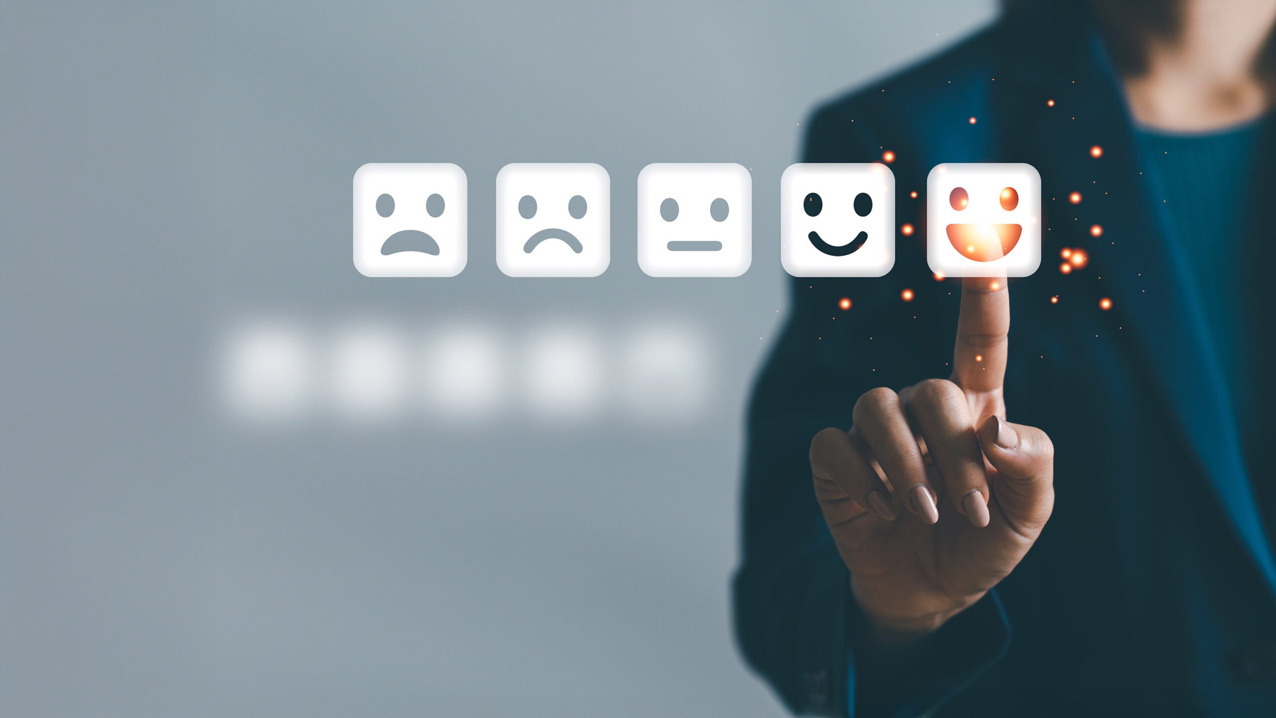 Finger selecting smiley face-rating icon