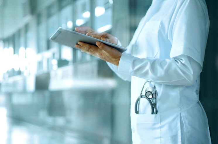 A healthcare doctor in a white lab coat