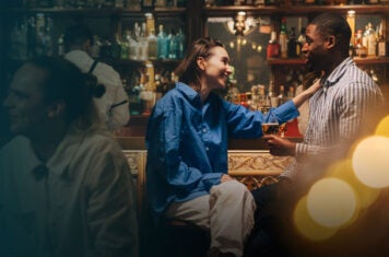 Couple enjoying drinks at a bar.