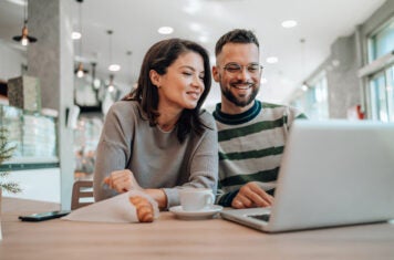 Woman and Man looking at laptop